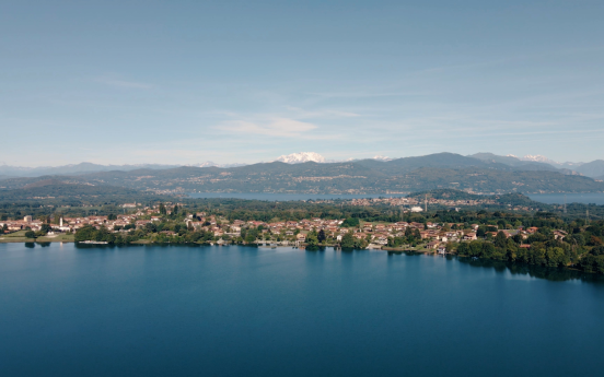 Drone view of Lake Varese. View of the Monte Rosa massif.